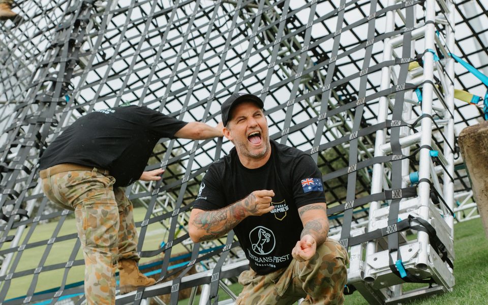 Competitor cheering at the cargo net on Day 1
